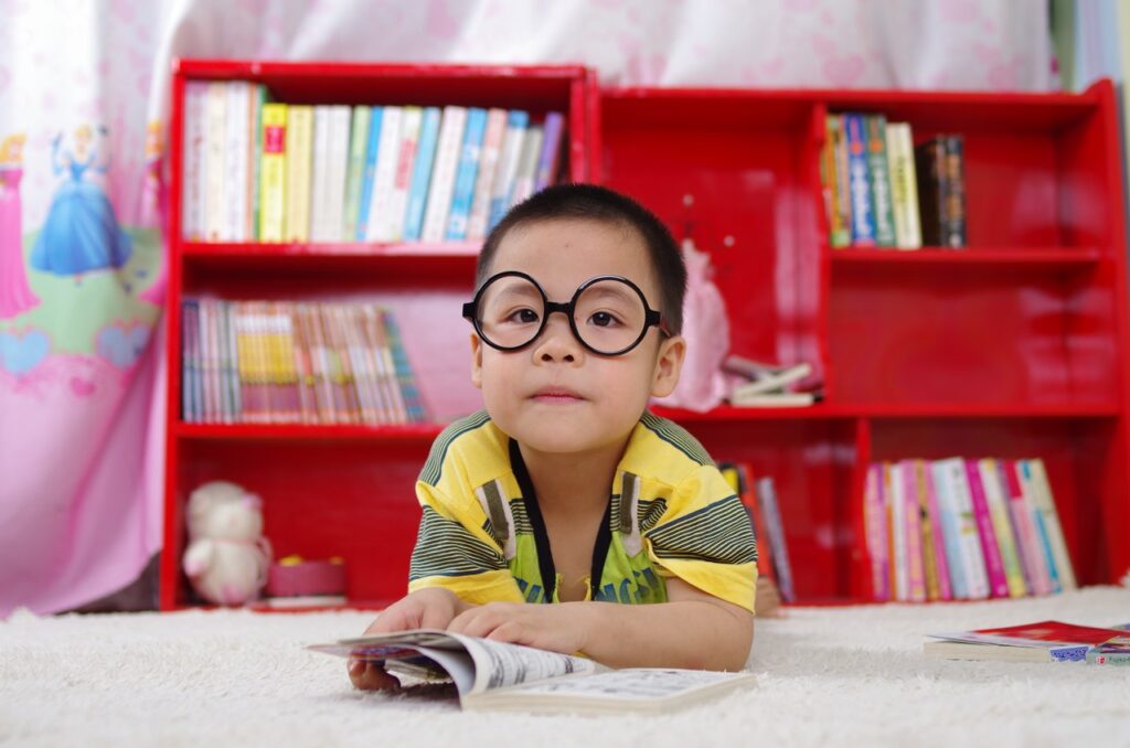 Beautiful boy reading a book